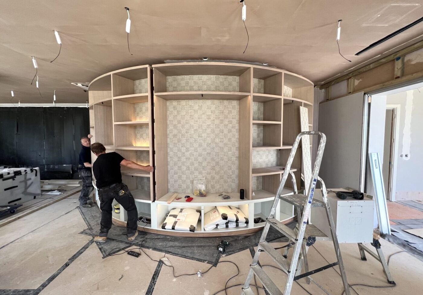 Installation of the curved stained ash cabinet
